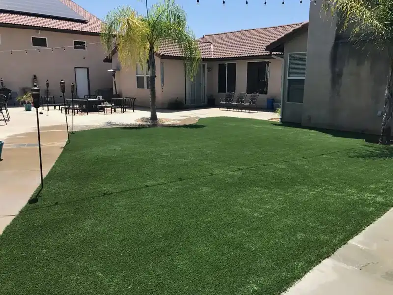 Artificial turf lawn installed around a swimming pool